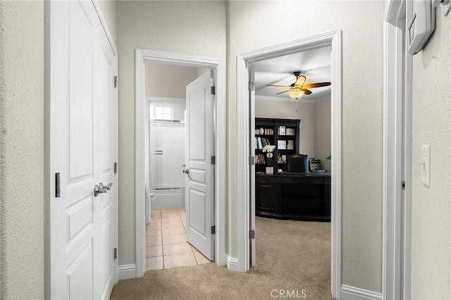 4802 Pentz Rd, Paradise, CA 95969 - hallway featuring light colored carpet, ornamental molding, light tile patterned floors, baseboards, and healthy amount of natural light
