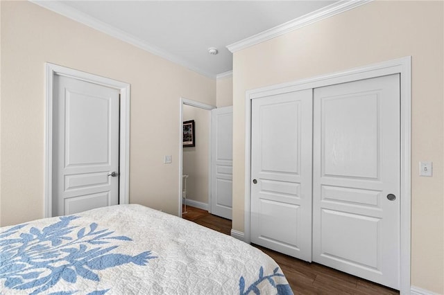 4802 Pentz Rd, Paradise, CA 95969 - bedroom with ornamental molding, dark wood-style floors, a closet, and baseboards