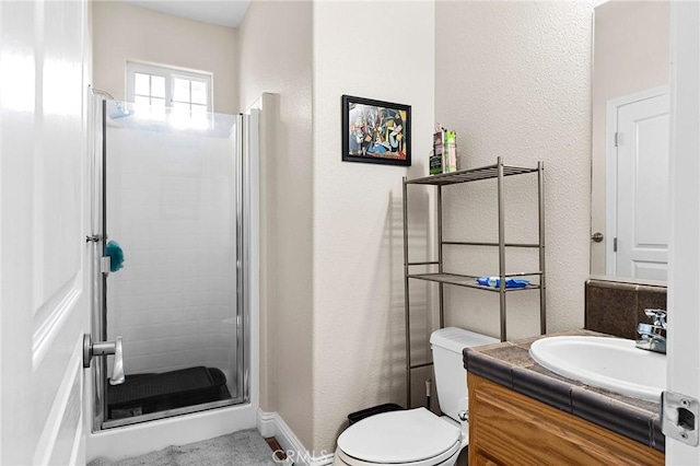 4802 Pentz Rd, Paradise, CA 95969 - full bath with a stall shower, vanity, toilet, a textured wall, and baseboards