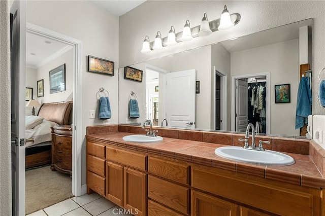 4802 Pentz Rd, Paradise, CA 95969 - ensuite bathroom featuring tile patterned floors, double vanity, and a walk in closet