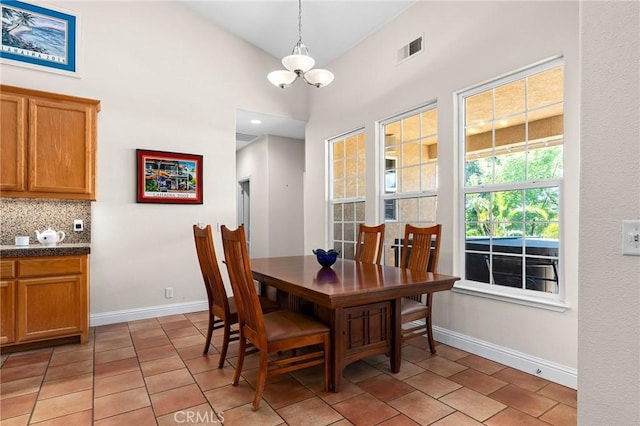 4802 Pentz Rd, Paradise, CA 95969 - dining area with a chandelier, baseboards, lofted ceiling, and light tile patterned floors