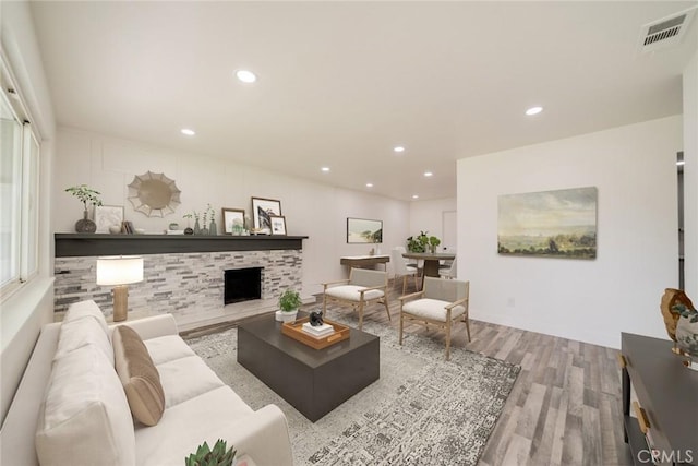 6622 Mitad Ct, San Bernardino, CA 92404 - living room featuring wood finished floors, recessed lighting, and a fireplace