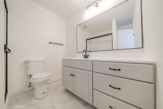 6622 Mitad Ct, San Bernardino, CA 92404 - bathroom featuring vanity, marble look tiles, and a shower with shower door