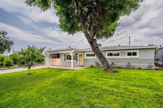 6622 Mitad Ct, San Bernardino, CA 92404 - rear view of house with a yard and a patio