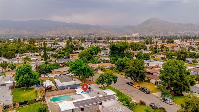 6622 Mitad Ct, San Bernardino, CA 92404 - aerial perspective of suburban area with a mountain backdrop and a pool