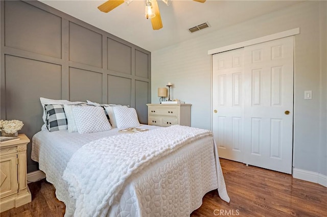 1122 Moonbeam Way, Turlock, CA 95382 - bedroom with dark wood-type flooring, a closet, a ceiling fan, and baseboards