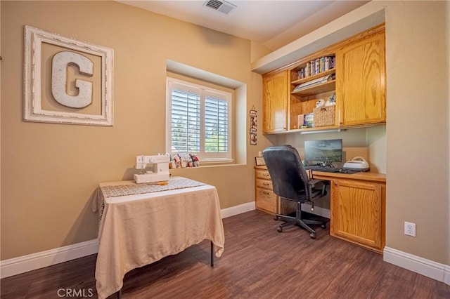 1122 Moonbeam Way, Turlock, CA 95382 - home office with dark wood-style flooring, baseboards, and built in desk