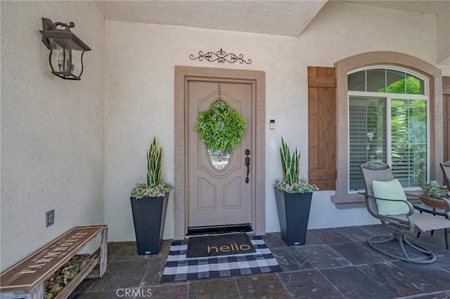 1122 Moonbeam Way, Turlock, CA 95382 - property entrance with stucco siding and a porch