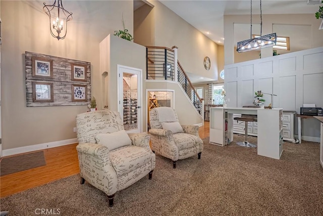1122 Moonbeam Way, Turlock, CA 95382 - living area with a high ceiling, a chandelier, stairway, baseboards, and an office area