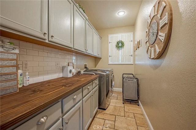 1122 Moonbeam Way, Turlock, CA 95382 - laundry room featuring washer and clothes dryer, cabinet space, baseboards, stone tile floors, and recessed lighting