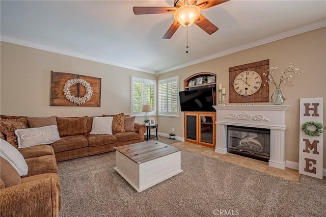 1122 Moonbeam Way, Turlock, CA 95382 - carpeted living room with crown molding, a ceiling fan, baseboards, and a glass covered fireplace