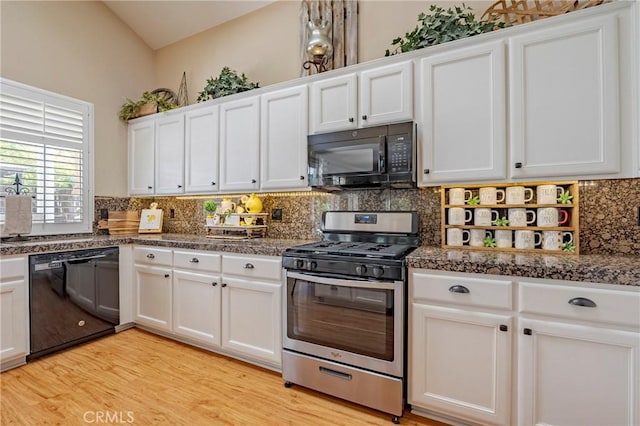 1122 Moonbeam Way, Turlock, CA 95382 - kitchen with black appliances, white cabinets, and backsplash