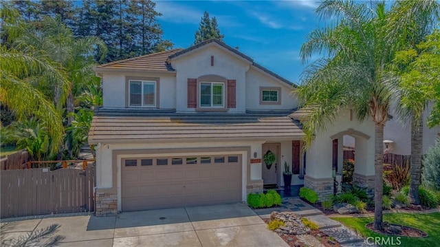 1122 Moonbeam Way, Turlock, CA 95382 - mediterranean / spanish house featuring concrete driveway, stucco siding, a tile roof, and an attached garage
