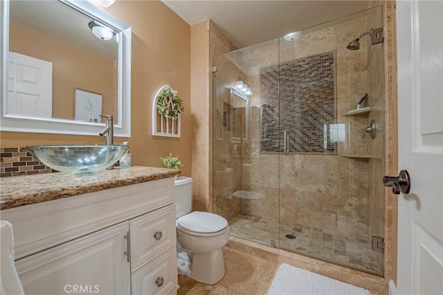 1122 Moonbeam Way, Turlock, CA 95382 - bathroom with vanity, toilet, a stall shower, and tile patterned flooring