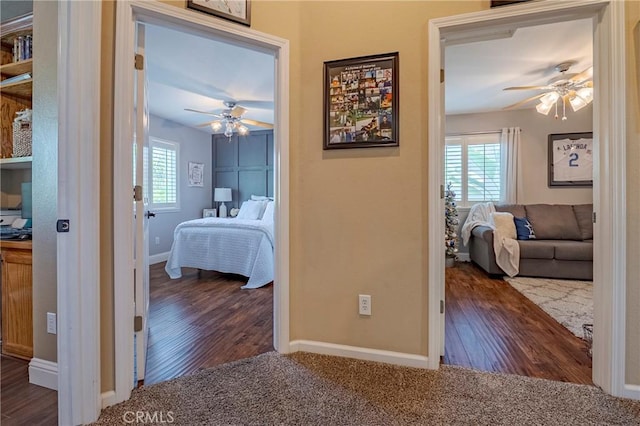 1122 Moonbeam Way, Turlock, CA 95382 - hallway featuring wood finished floors, baseboards, and carpet floors