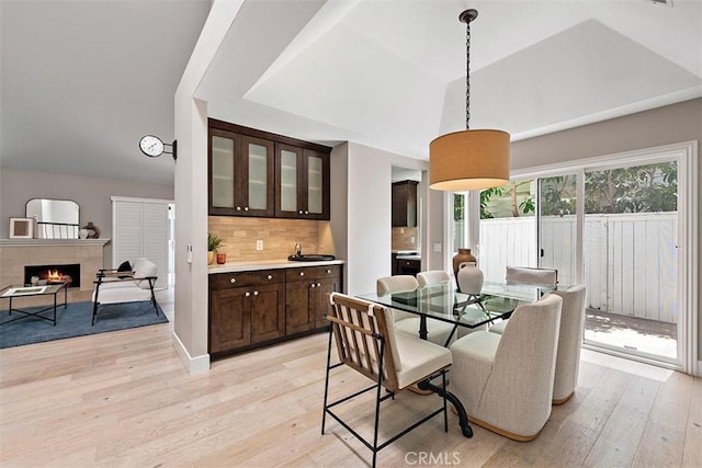 1890 Orange Ave, Costa Mesa, CA 92627 - dining area featuring light wood-style flooring and a tile fireplace