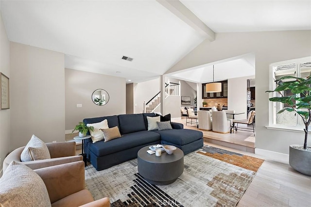 1890 Orange Ave, Costa Mesa, CA 92627 - living area with light wood-style flooring, stairs, beamed ceiling, and high vaulted ceiling