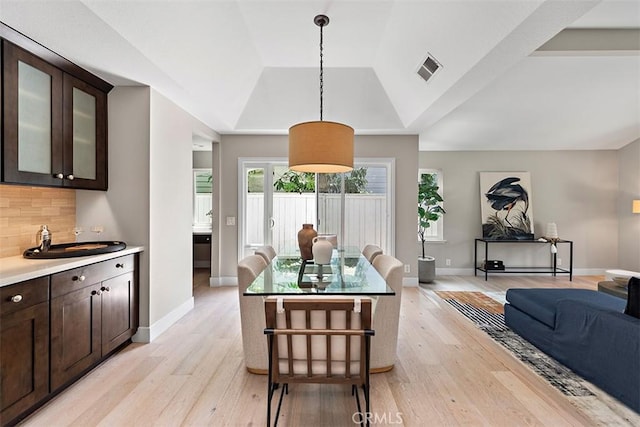 1890 Orange Ave, Costa Mesa, CA 92627 - dining space with light wood-type flooring and a raised ceiling