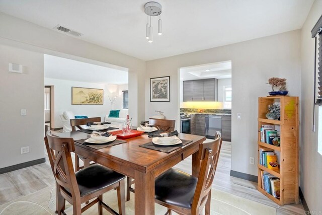 3332 Heather Ridge Ct, San Marcos, CA 92078 - dining space with baseboards and light wood-style flooring