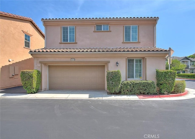 13029 Waterlily Way, Chino, CA 91710 - view of front of property featuring stucco siding, a garage, and a tiled roof