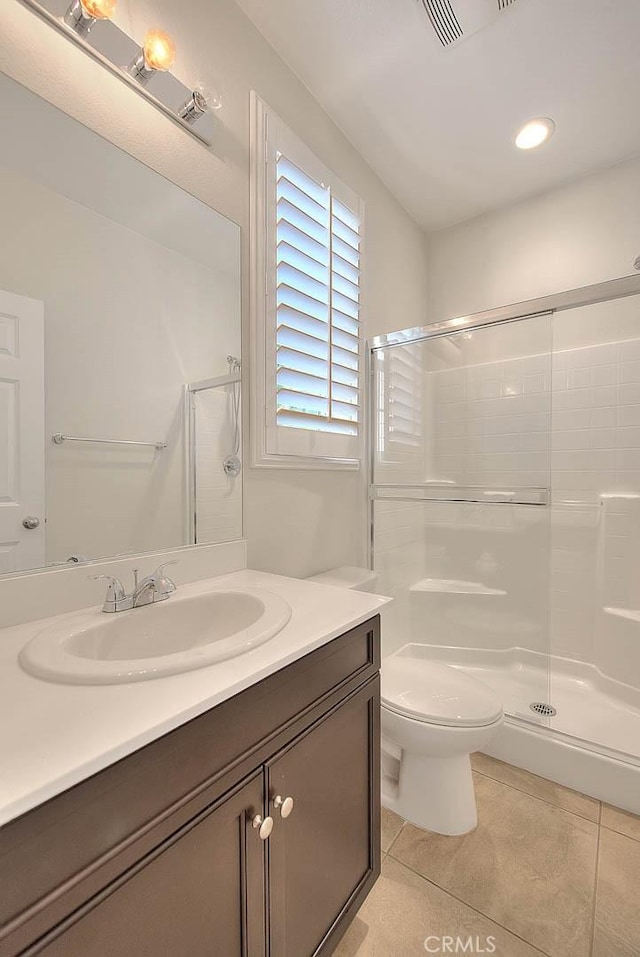 13029 Waterlily Way, Chino, CA 91710 - bathroom with vanity, tile patterned flooring, and a shower with door