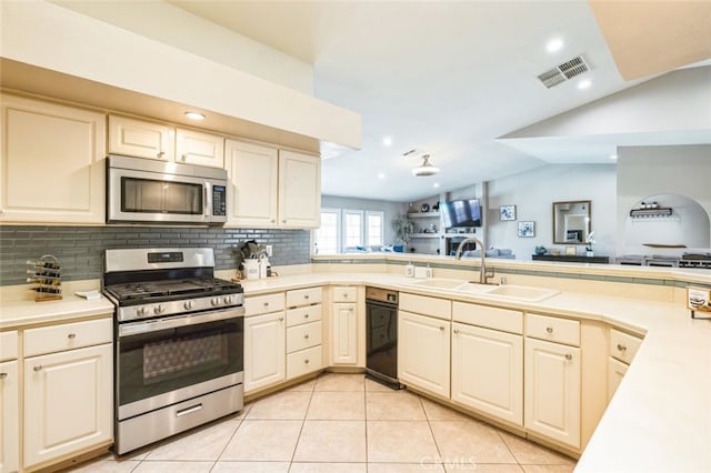 43300 Warner Trl, Palm Desert, CA 92211 - kitchen featuring stainless steel appliances, a sink, light countertops, tasteful backsplash, and recessed lighting