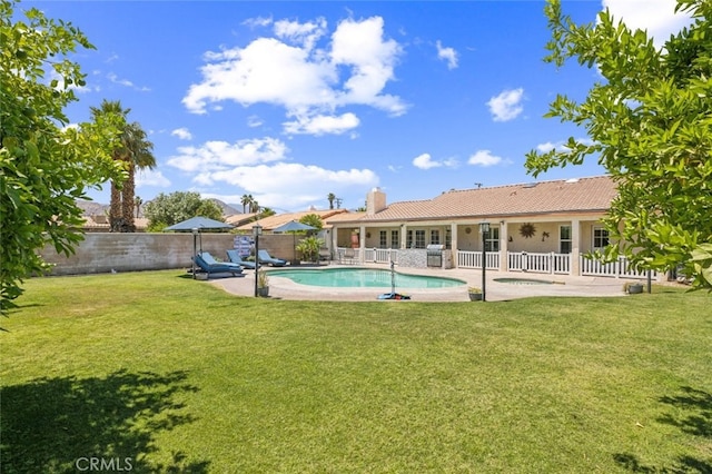 43300 Warner Trl, Palm Desert, CA 92211 - back of property with a patio, a chimney, a tiled roof, and stucco siding