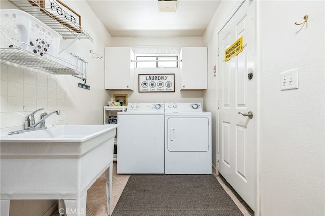 43300 Warner Trl, Palm Desert, CA 92211 - washroom featuring cabinet space, independent washer and dryer, and light tile patterned floors