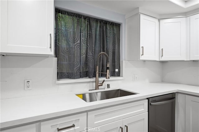 4259 Fulton Ave Unit 103, Sherman Oaks, CA 91423 - kitchen featuring stainless steel dishwasher, a sink, light countertops, and white cabinetry