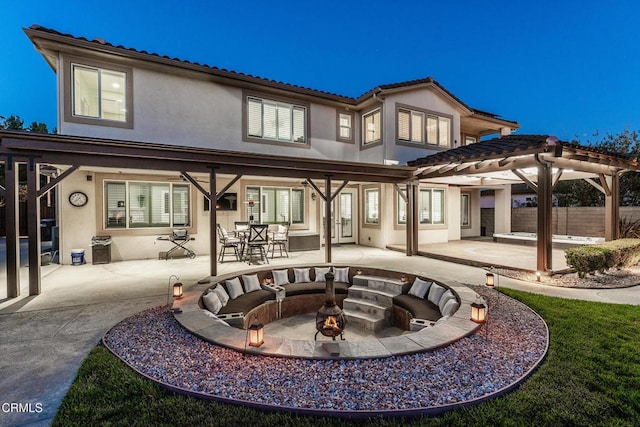 12428 Palmer Dr, Moorpark, CA 93021 - rear view of house featuring a fire pit, stucco siding, a pergola, a patio area, and a tile roof