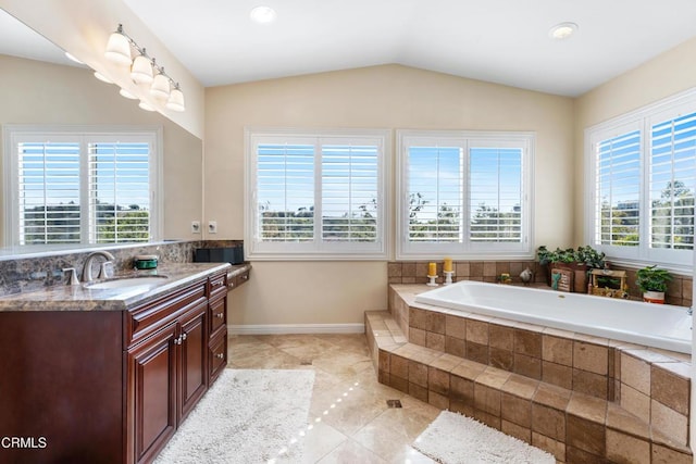 12428 Palmer Dr, Moorpark, CA 93021 - bathroom with vanity, a bath, lofted ceiling, tile patterned flooring, and decorative backsplash