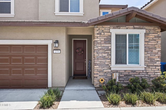 275 Fuerte Dr, Santa Paula, CA 93060 - entrance to property with stone siding, stucco siding, and an attached garage