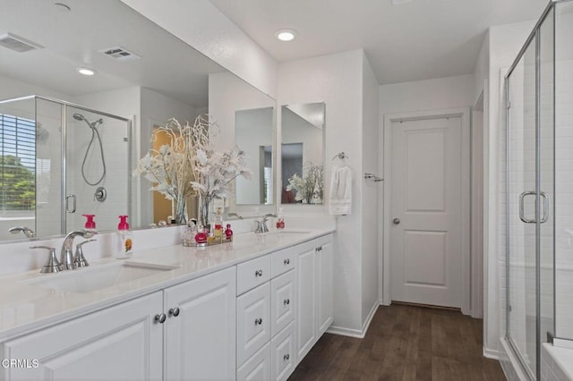 275 Fuerte Dr, Santa Paula, CA 93060 - bathroom featuring a stall shower, double vanity, and wood finished floors