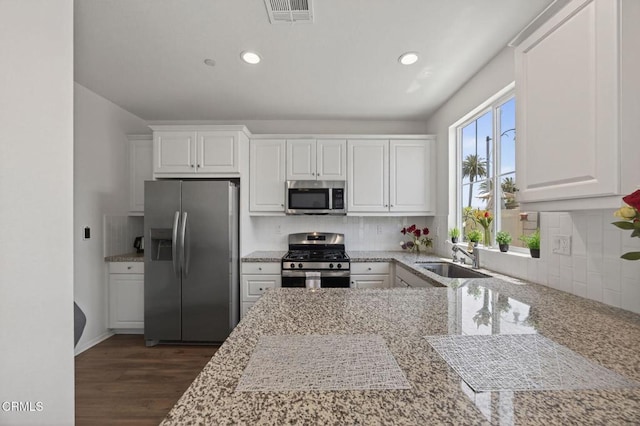 275 Fuerte Dr, Santa Paula, CA 93060 - kitchen featuring stainless steel appliances, white cabinets, backsplash, and recessed lighting