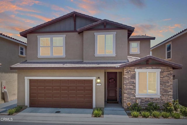 275 Fuerte Dr, Santa Paula, CA 93060 - craftsman-style house with stone siding, stucco siding, an attached garage, and board and batten siding