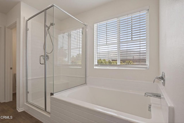 275 Fuerte Dr, Santa Paula, CA 93060 - bathroom with a garden tub, a stall shower, and wood finished floors