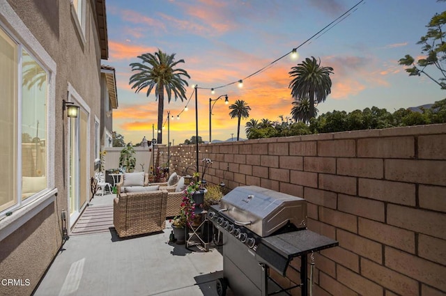 275 Fuerte Dr, Santa Paula, CA 93060 - patio terrace at dusk featuring an outdoor living space, a fenced backyard, a patio area, and grilling area