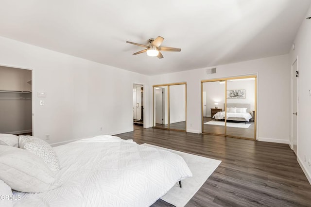 22769 Macfarlane Dr, Woodland Hills, CA 91364 - bedroom featuring dark wood-style floors, multiple closets, and ceiling fan