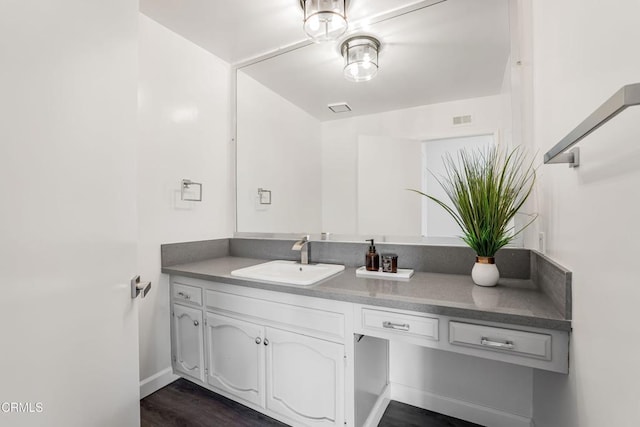22769 Macfarlane Dr, Woodland Hills, CA 91364 - bathroom featuring vanity and wood finished floors