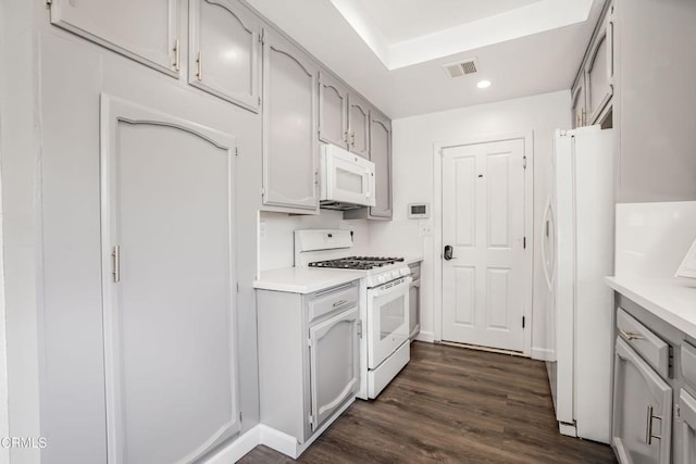 22769 Macfarlane Dr, Woodland Hills, CA 91364 - kitchen featuring white appliances, dark wood-style flooring, light countertops, recessed lighting, and gray cabinetry