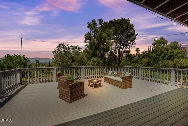 22769 Macfarlane Dr, Woodland Hills, CA 91364 - deck at dusk with an outdoor living space with a fire pit