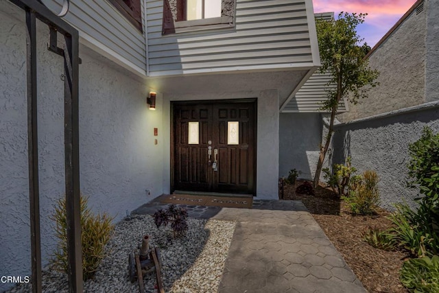 22769 Macfarlane Dr, Woodland Hills, CA 91364 - exterior entry at dusk with stucco siding