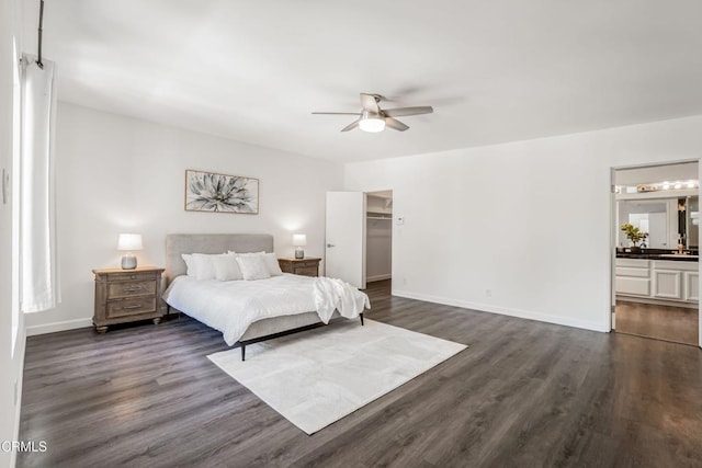 22769 Macfarlane Dr, Woodland Hills, CA 91364 - bedroom featuring dark wood-style floors, a walk in closet, ceiling fan, and connected bathroom