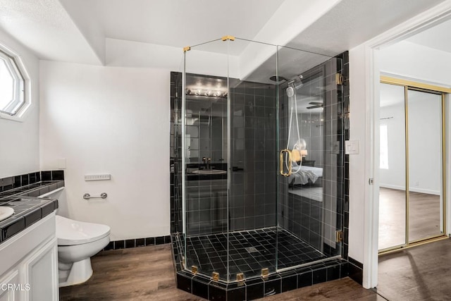 22769 Macfarlane Dr, Woodland Hills, CA 91364 - bathroom featuring vanity, a shower stall, and wood finished floors