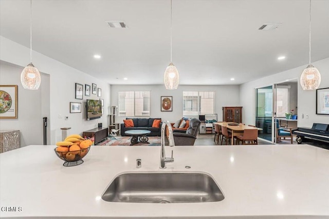 2830 Wagon Wheel Rd Unit 304, Oxnard, CA 93036 - kitchen featuring open floor plan, hanging light fixtures, light countertops, and recessed lighting