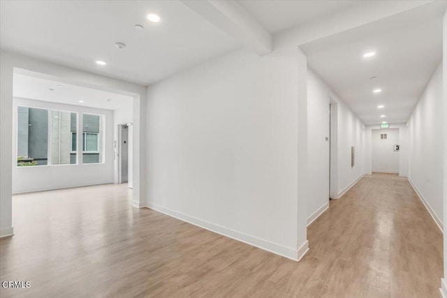 2830 Wagon Wheel Rd Unit 304, Oxnard, CA 93036 - hall featuring light wood finished floors, recessed lighting, and beam ceiling