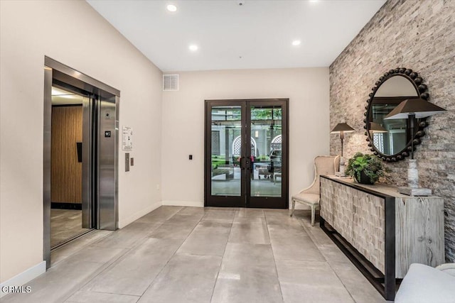 2830 Wagon Wheel Rd Unit 304, Oxnard, CA 93036 - foyer featuring elevator, french doors, recessed lighting, and concrete floors