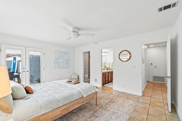 5222 Whitecap St, Oxnard, CA 93035 - bedroom featuring french doors, light tile patterned floors, access to outside, connected bathroom, and ceiling fan