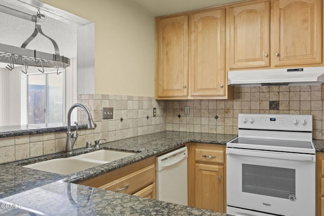 5576 Holly Ridge Dr, Camarillo, CA 93012 - kitchen featuring white appliances, under cabinet range hood, backsplash, dark stone countertops, and light brown cabinets
