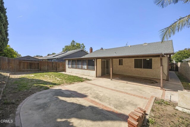 5576 Holly Ridge Dr, Camarillo, CA 93012 - rear view of property with a sunroom, a fenced backyard, a patio area, and a shingled roof